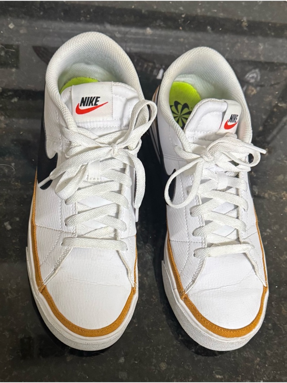 Nike White Low-Top Sneakers with Gold Accent